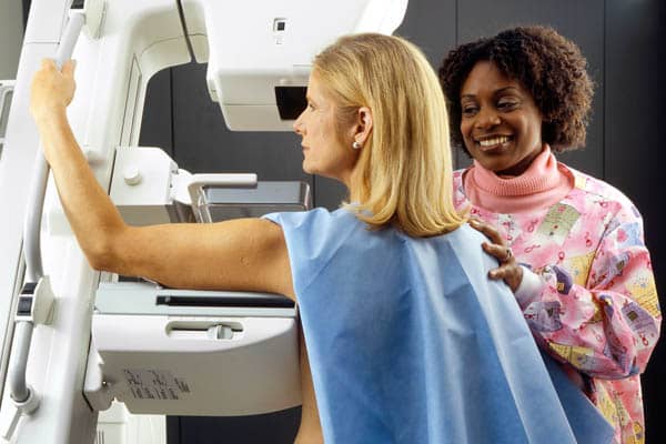 breast cancer awareness month october 2021 woman receiving mammogram