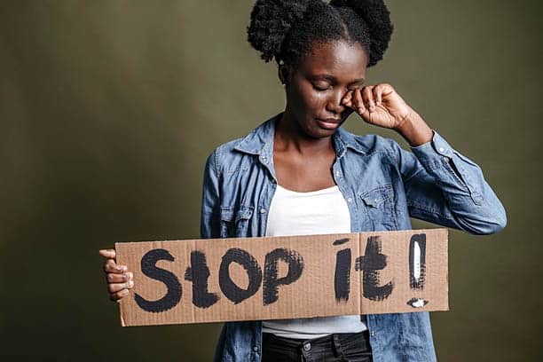 womans month august 2022 abused south africas woman hold sign stop it